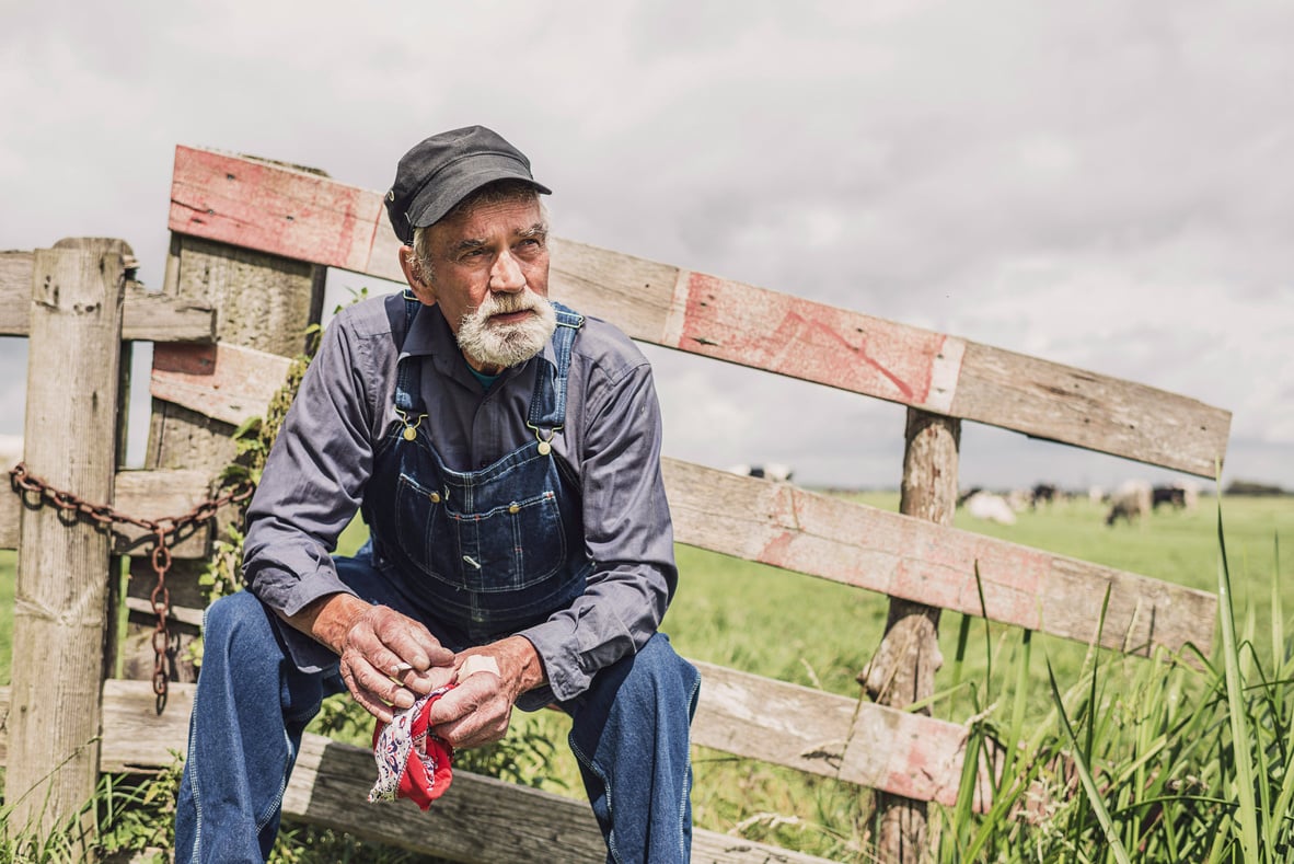 Elderly Farm Worker Sitting Relaxing